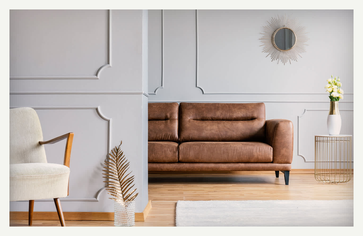 living room with couch and chair with textured wall