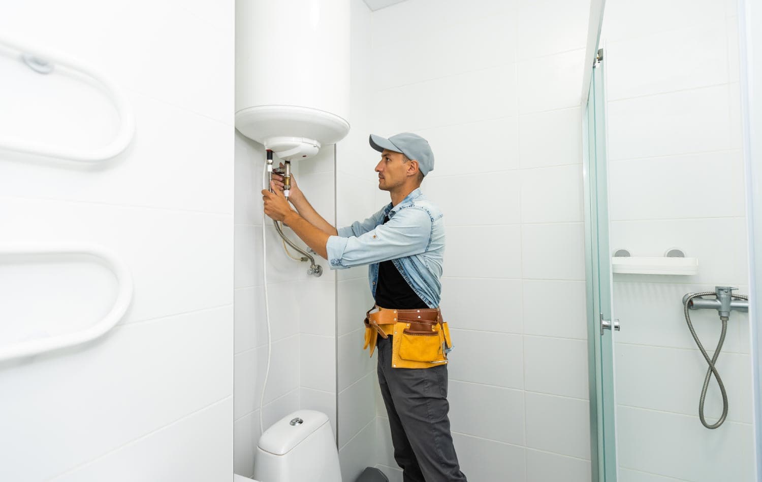 A plumber repairing a water heater