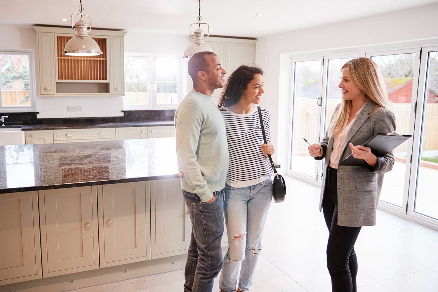 Realtor showing couple a house for sale