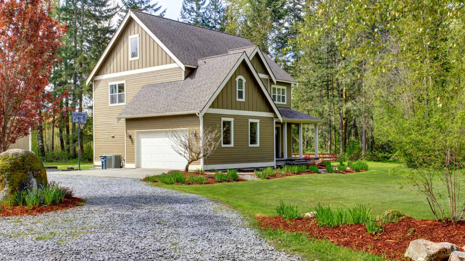 A countryside house entrance and gravel driveway