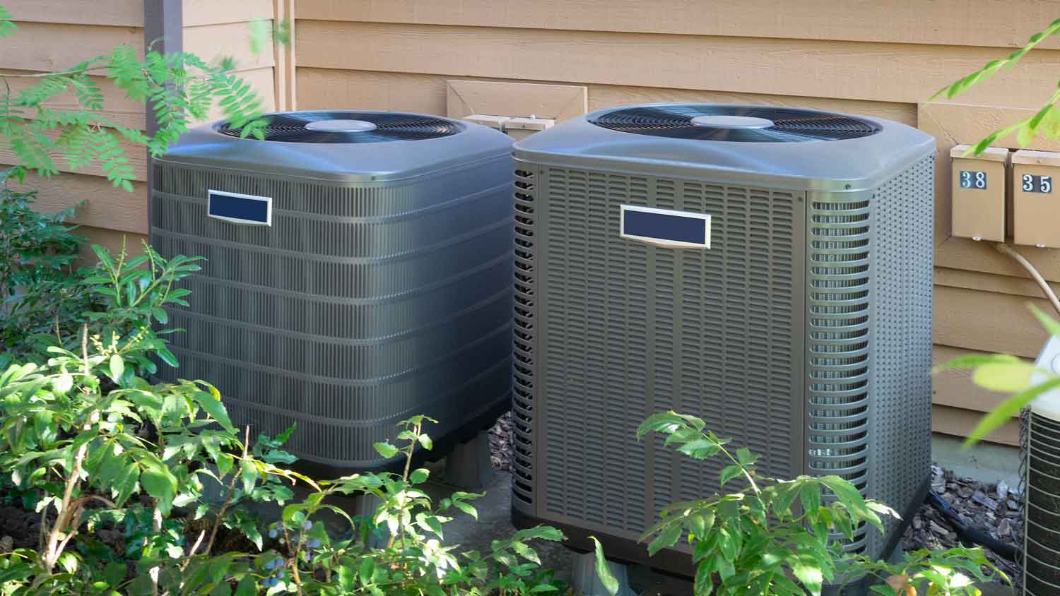 Two AC units outside a house