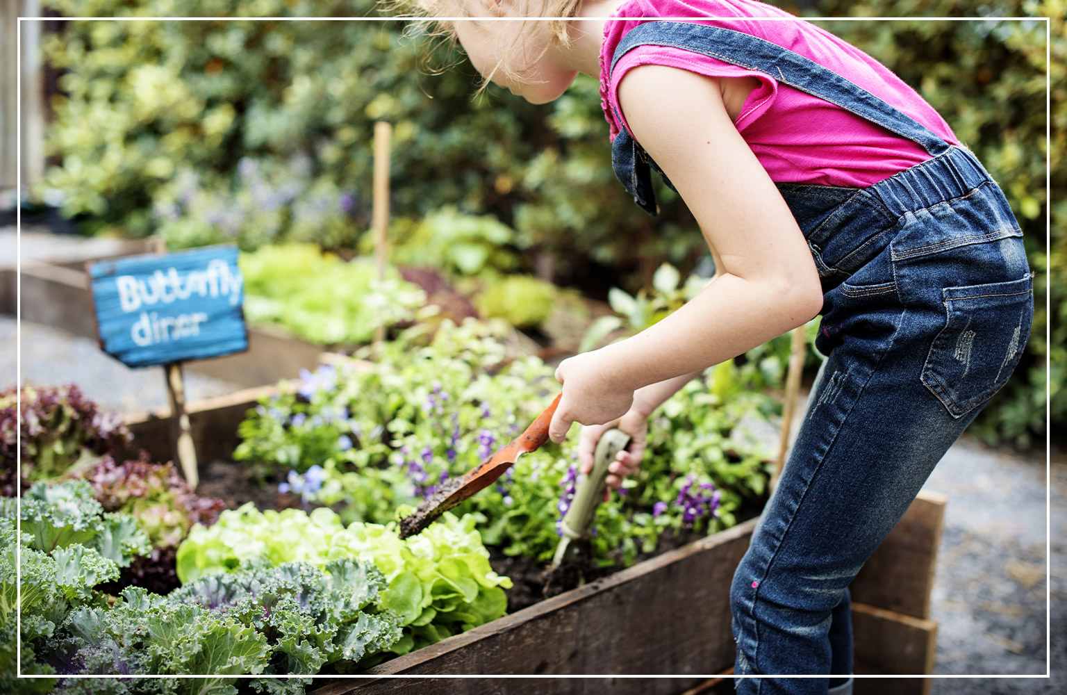 little girl working in garden