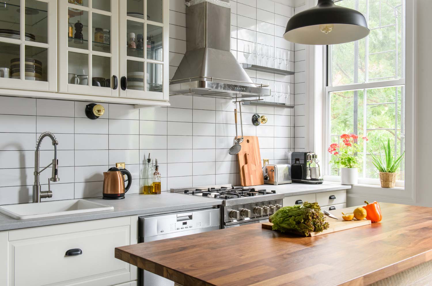 A modern kitchen with a range hoods