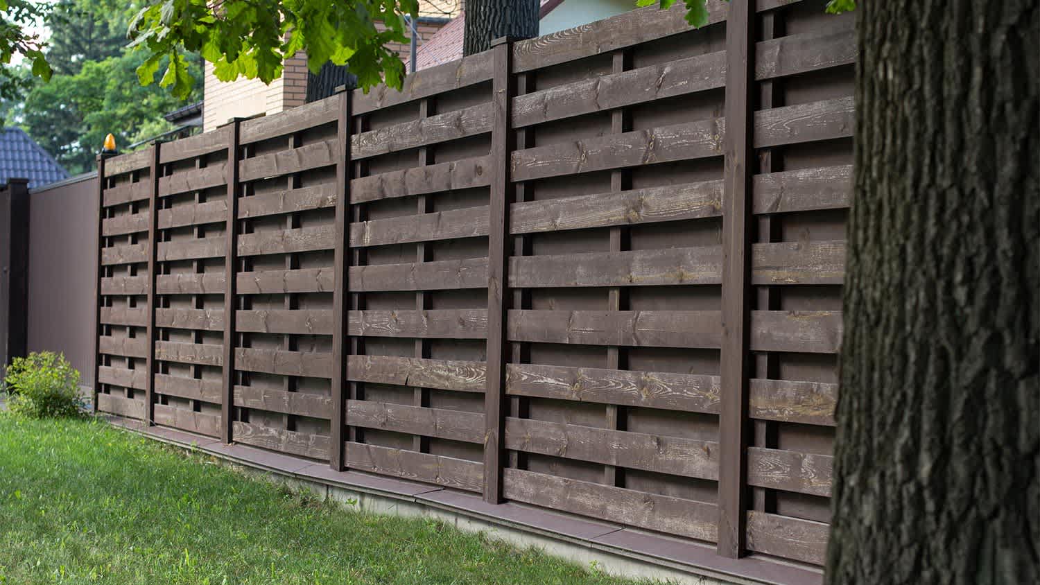Louvered wooden Fence in backyard