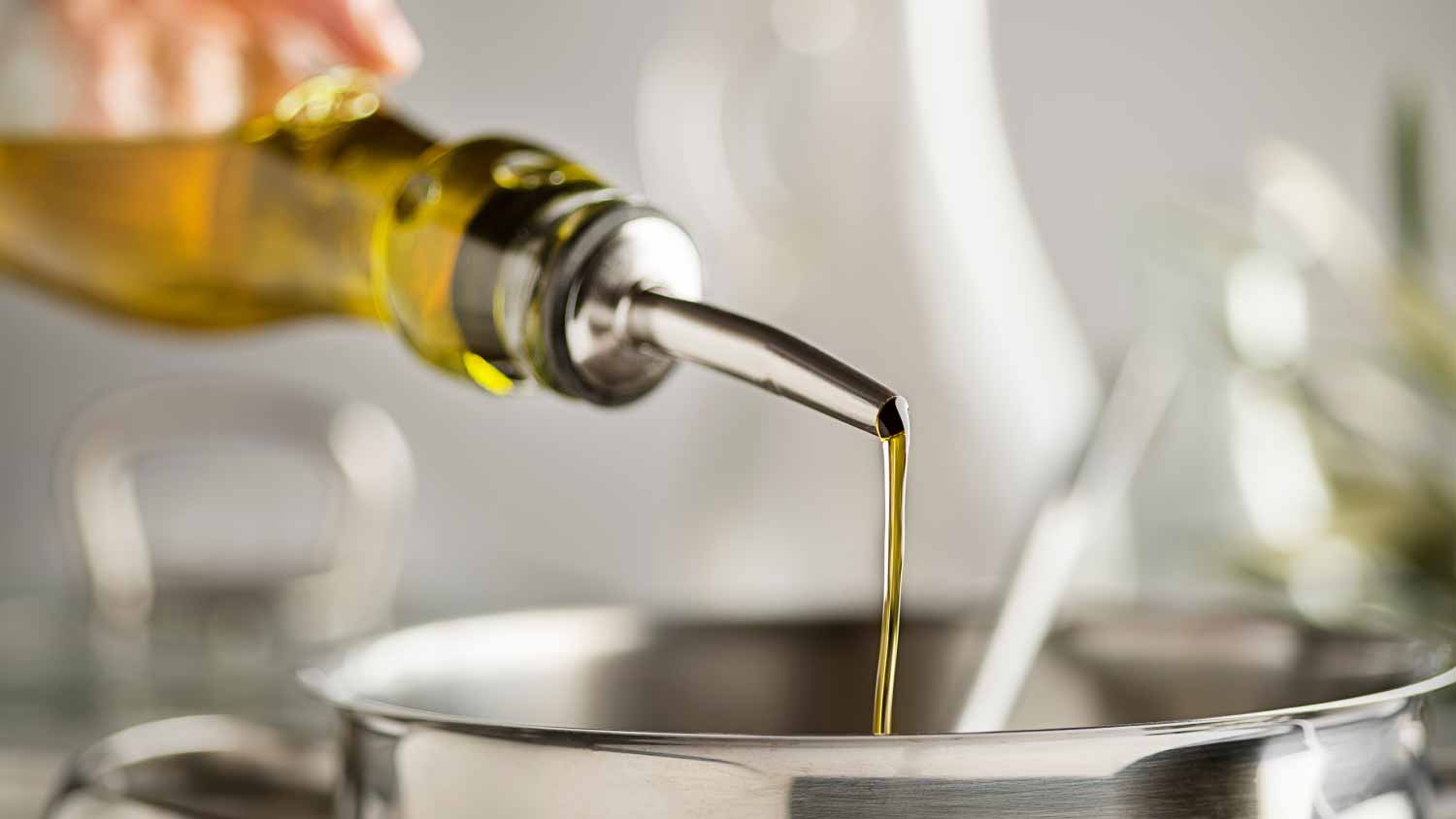 A person dropping oil