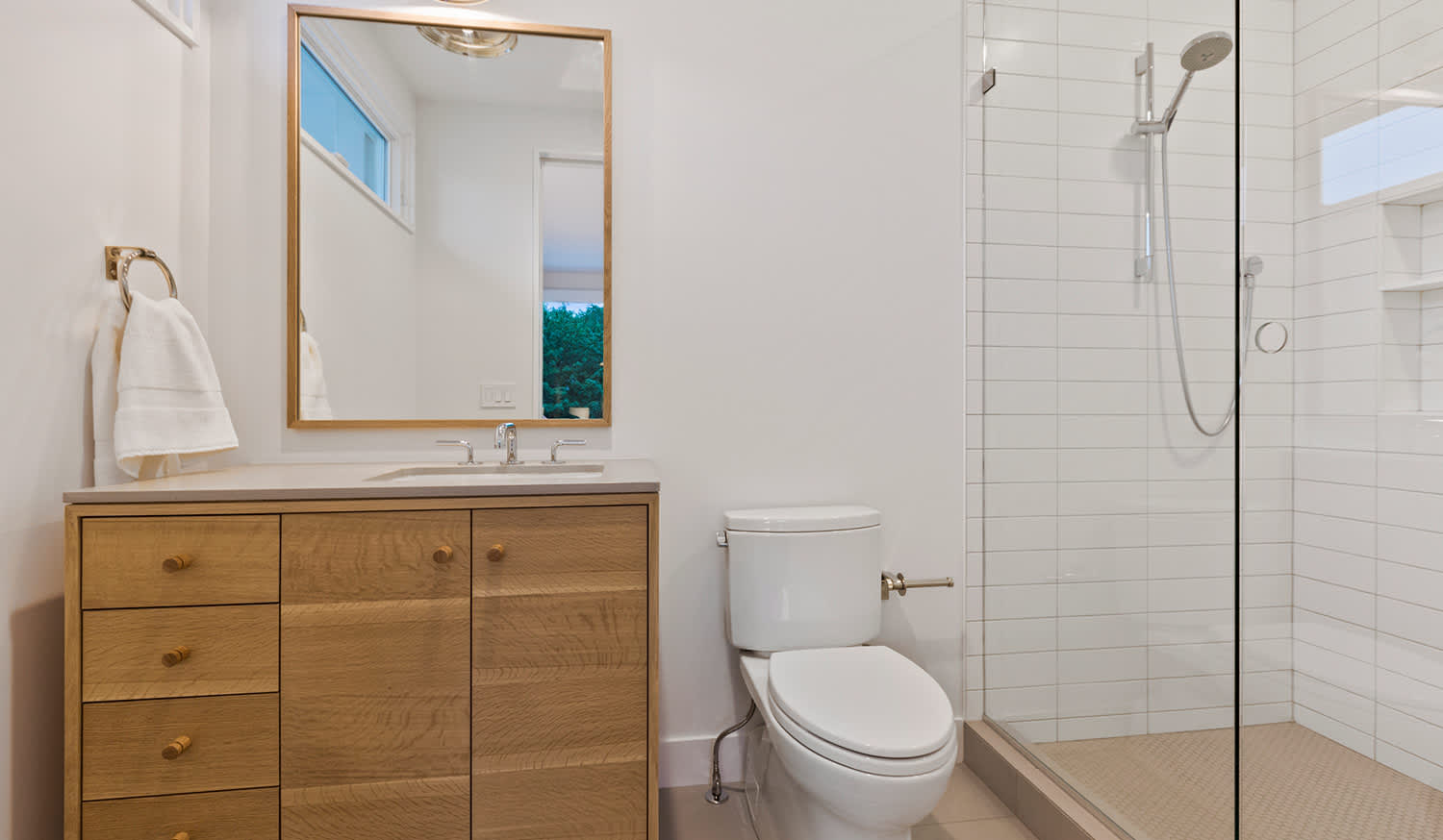 Modern bathroom with wood cabinets