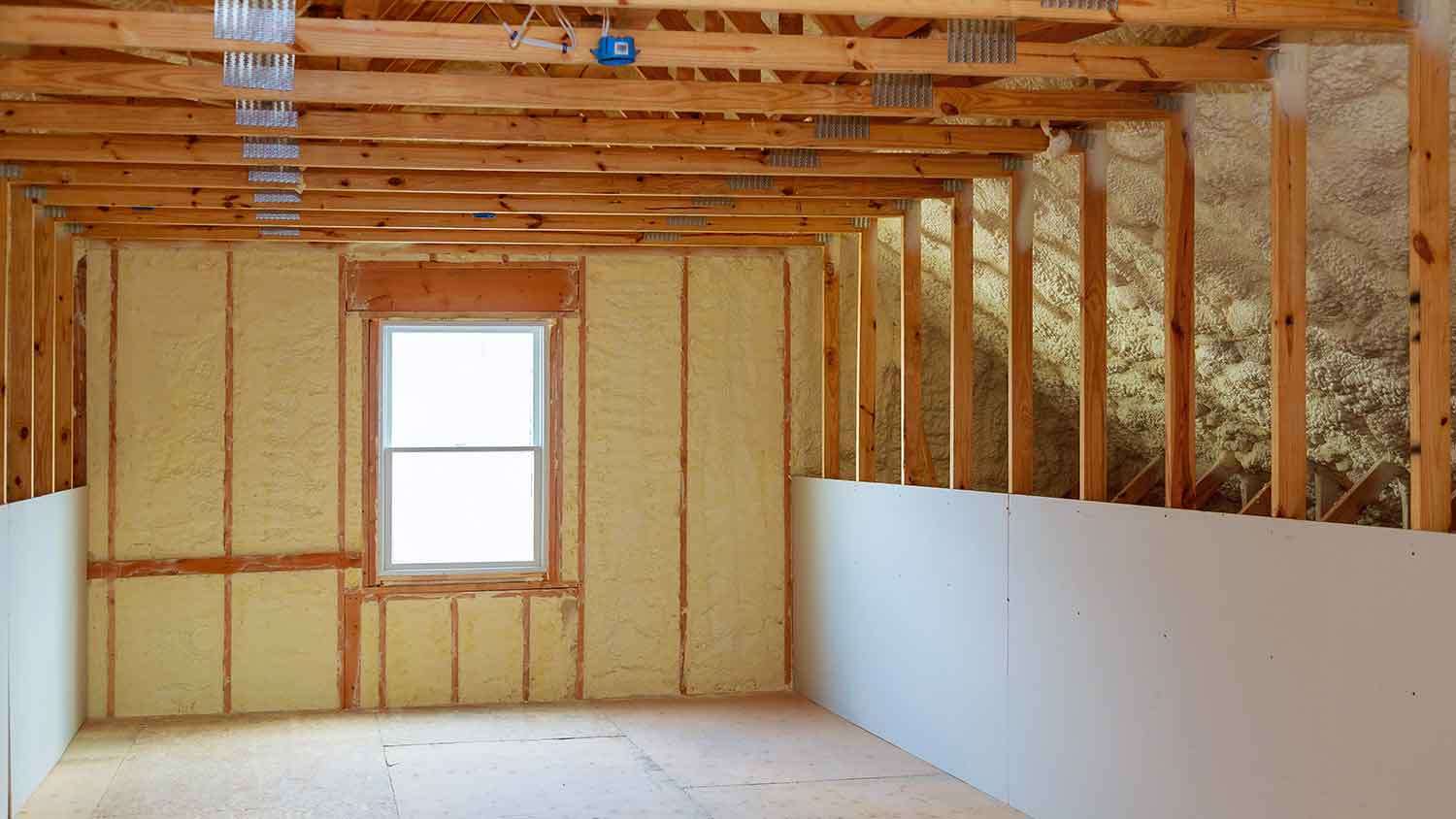 Home attic with spray foam insulation