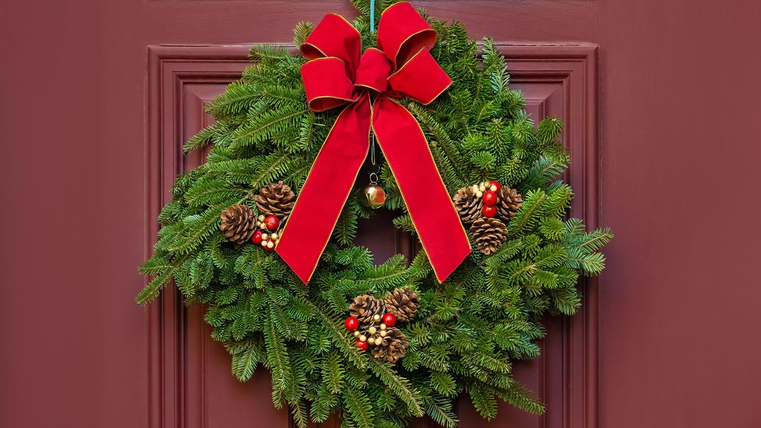 big red bow on green wreath
