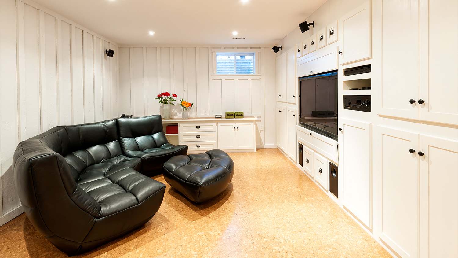 finished basement setup with TV and couch