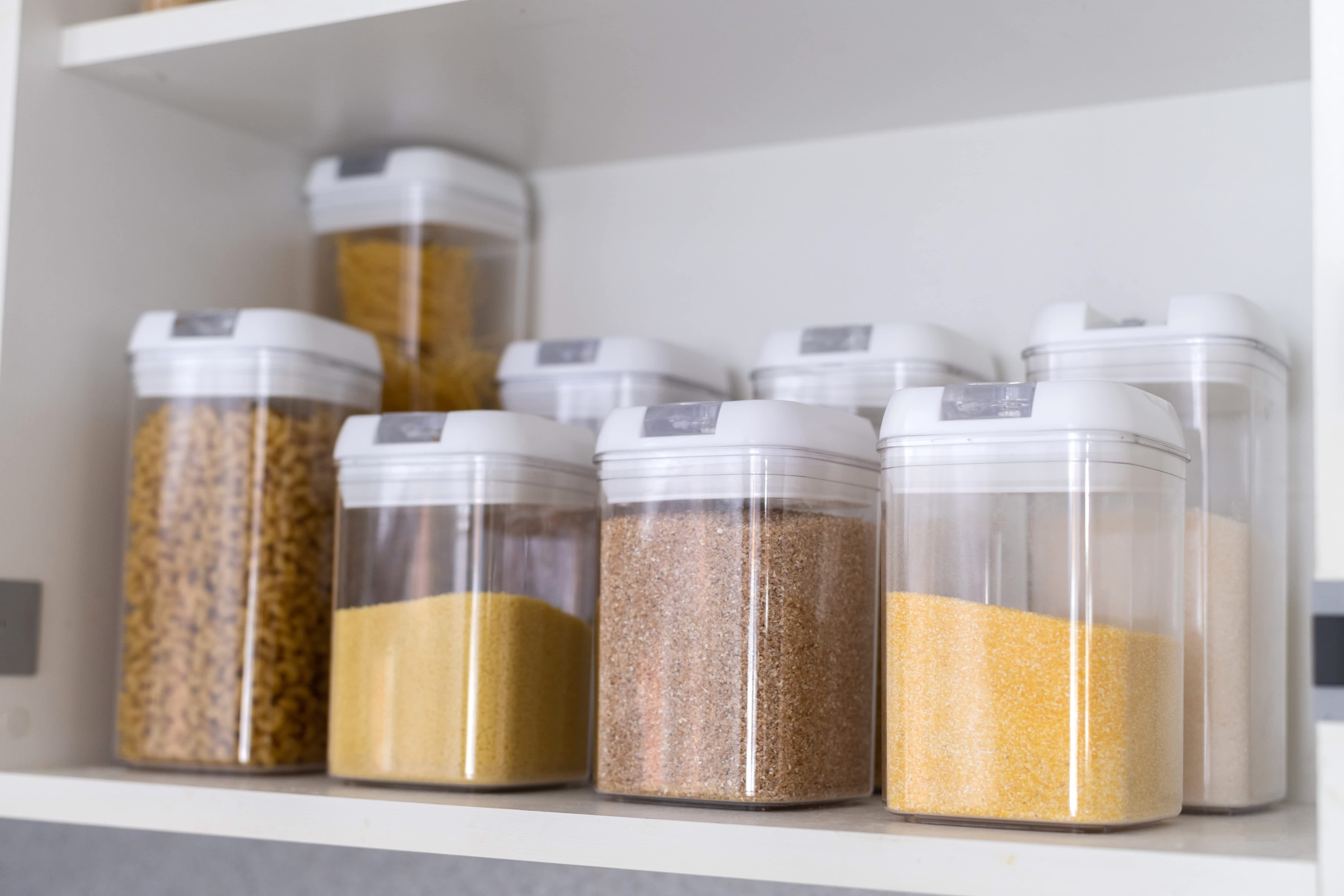 Clear food storage containers in kitchen pantry