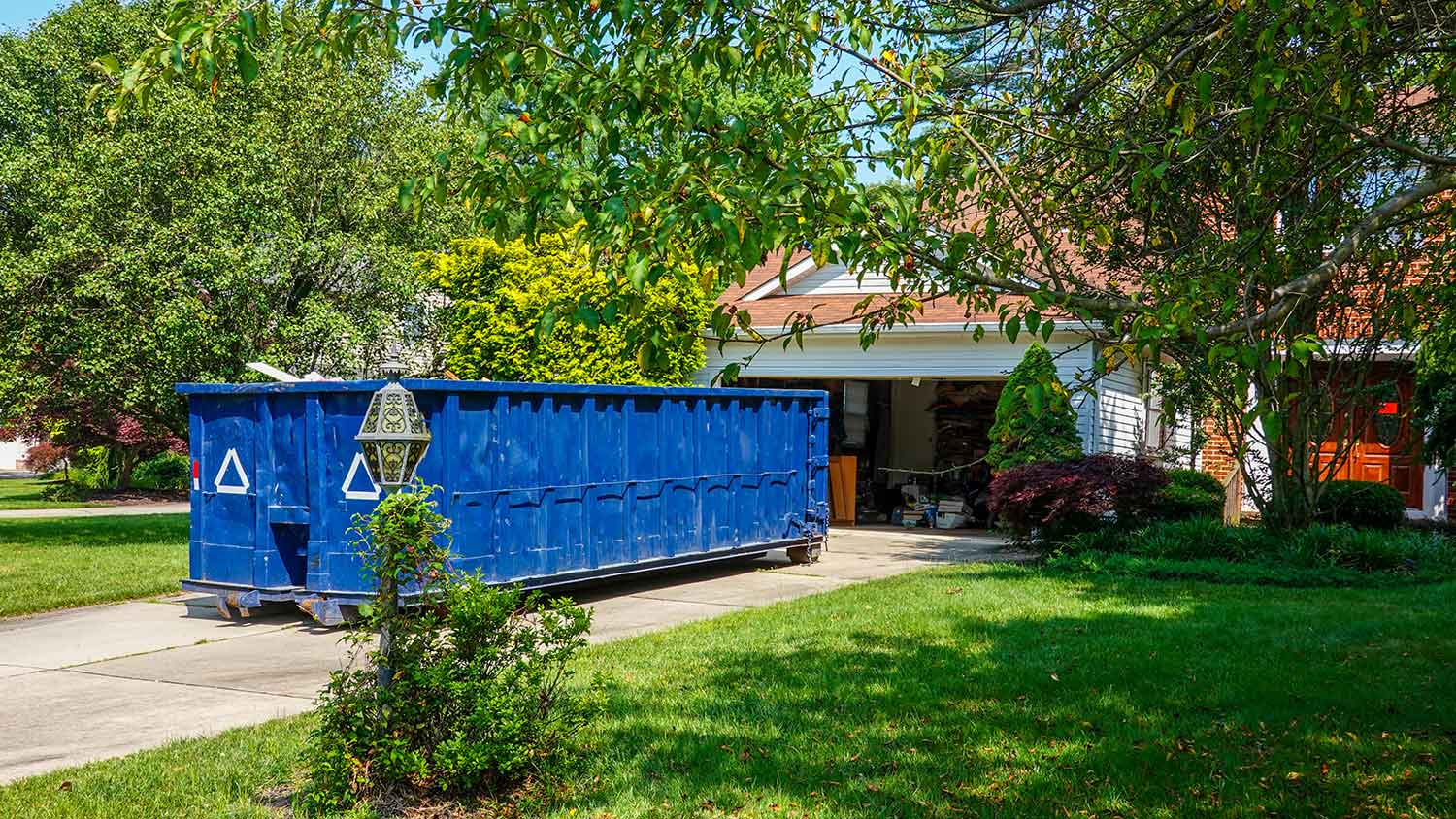 Dumpster in front of house