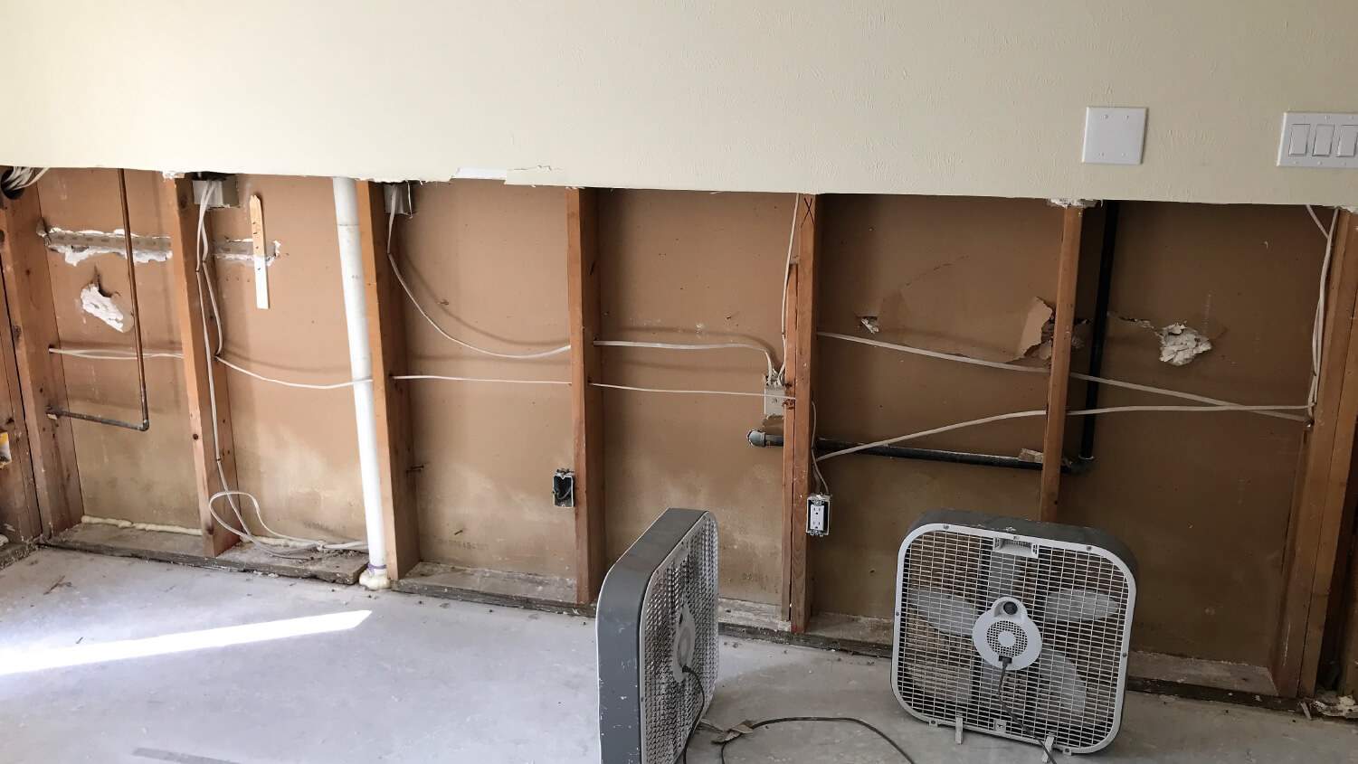 Home gutted after hurricane flood with fans drying house