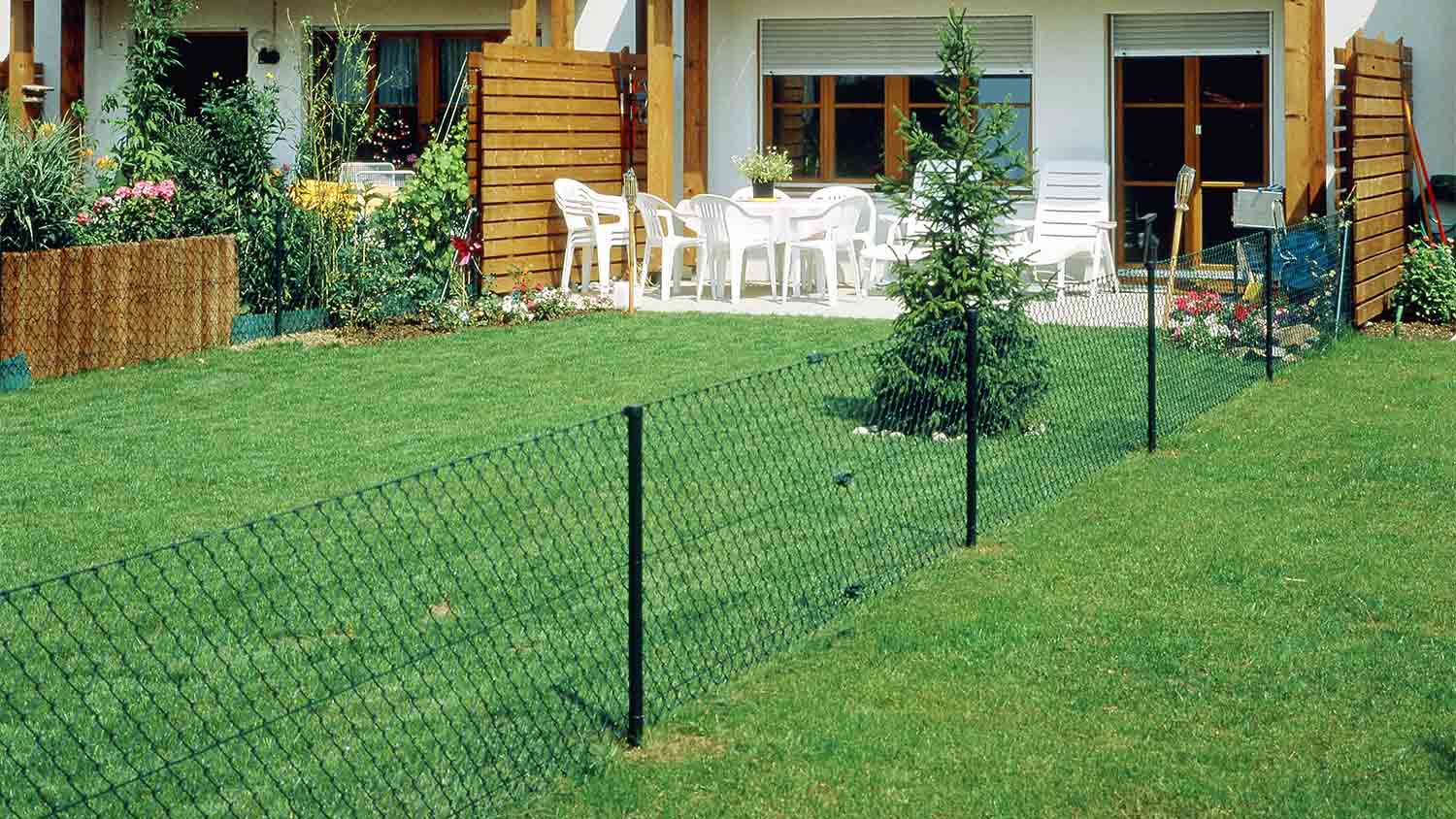 backyard house with chain link fence