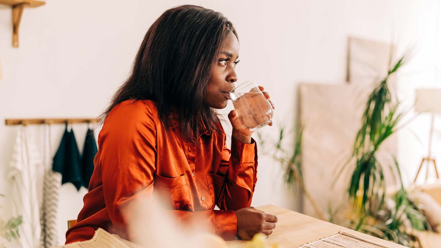 A woman drinking water from a glass