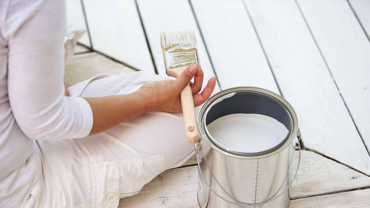 woman painting deck