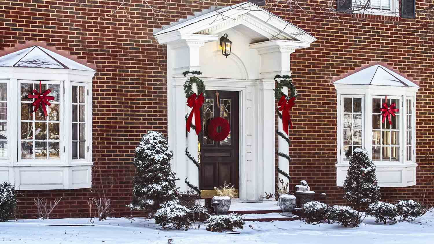 house with columns decorated with wreaths