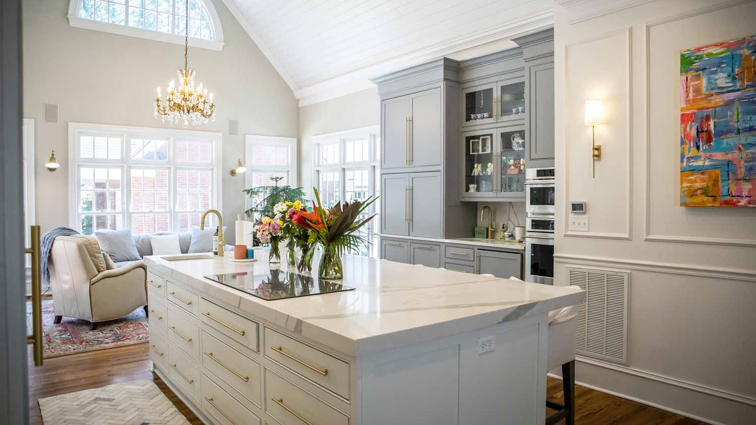 An open-space living room and kitchen with vaulted ceiling