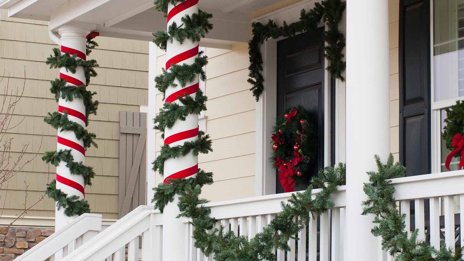 columns wrapped in christmas garland