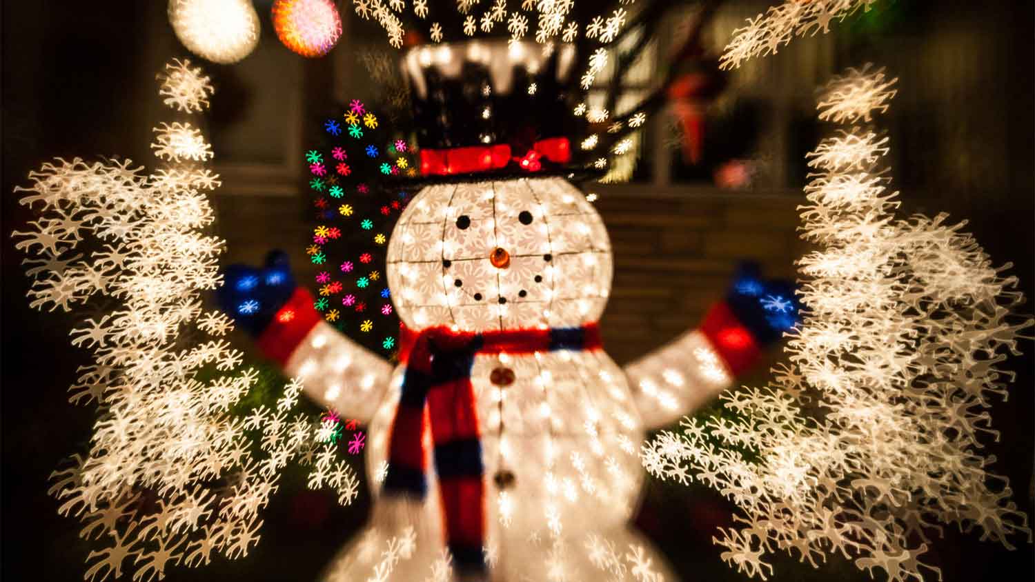 A view of a decorative snowman and Christmas lights