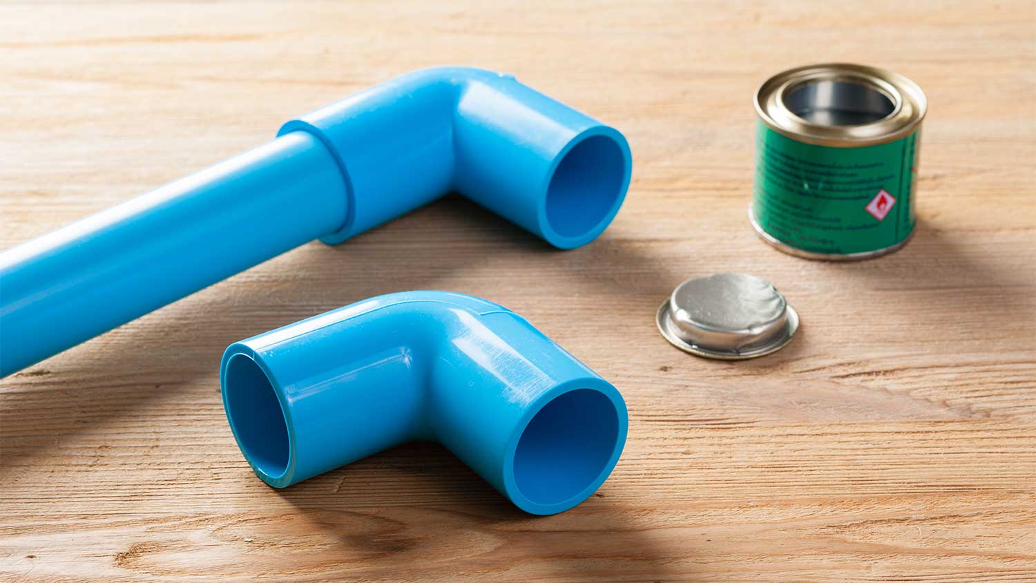 A view of blue pipes and PVC glue