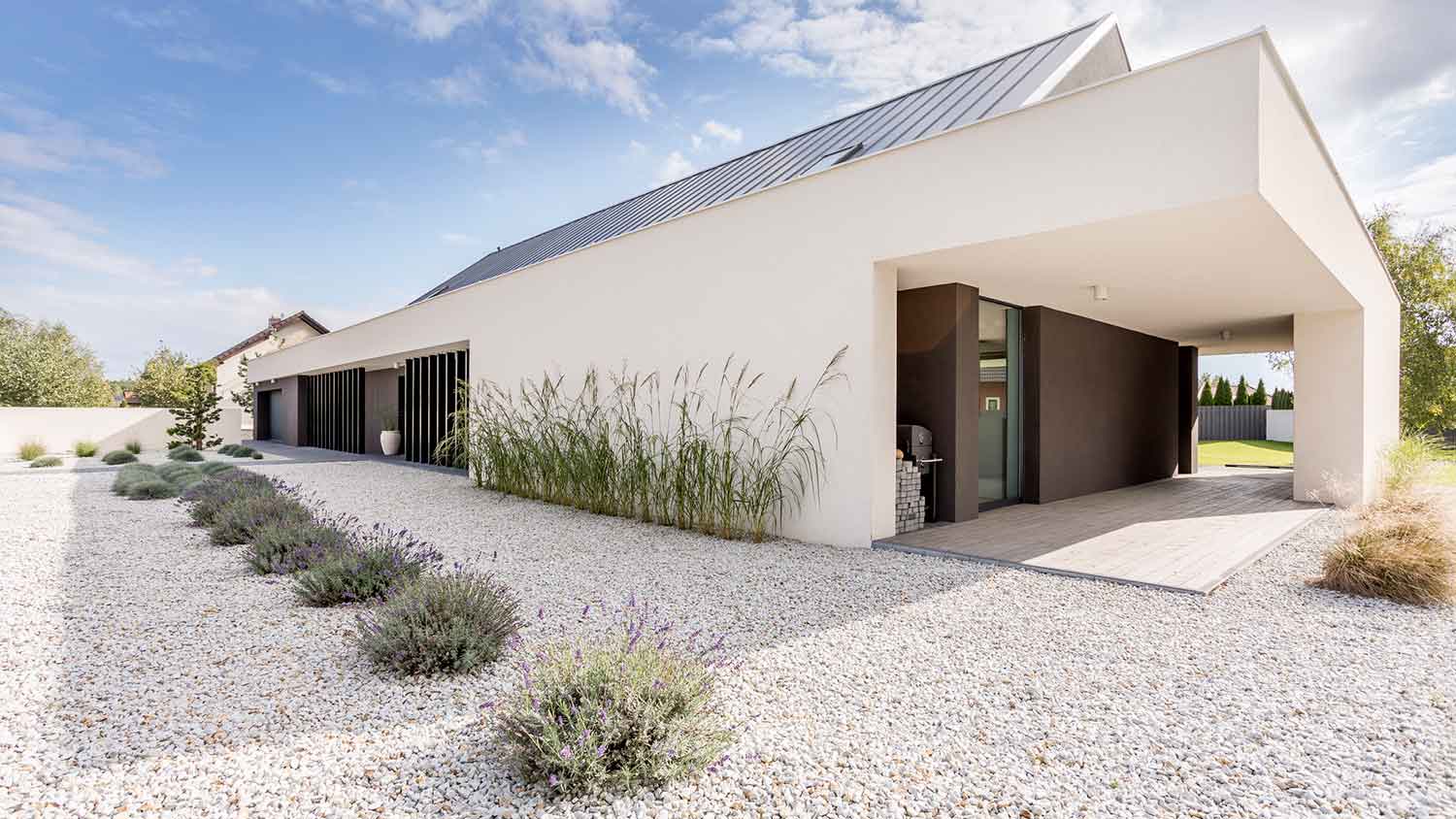Modern villa with white gravel xeriscape