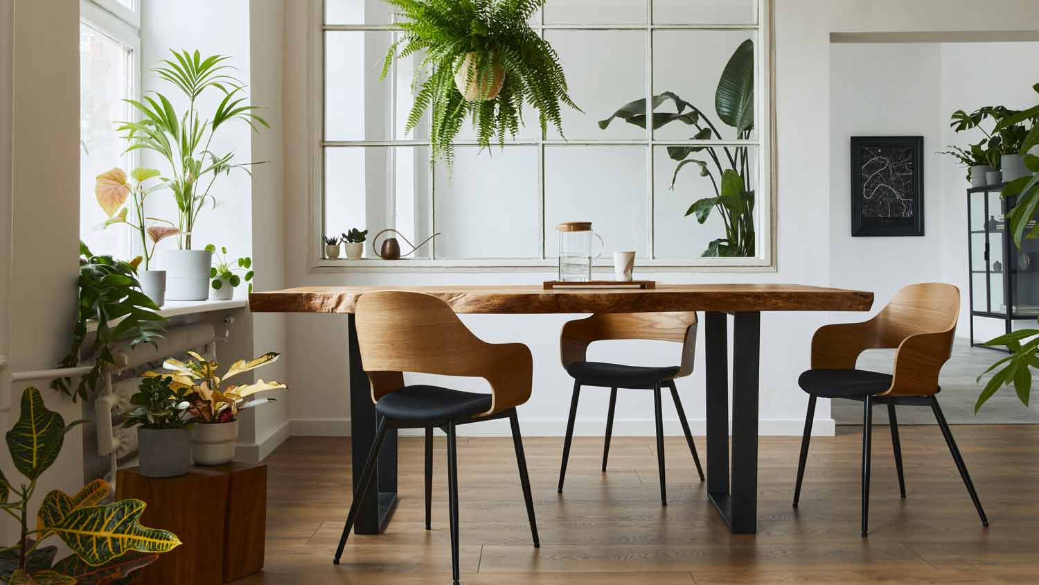 A dining area in a house with wooden floors