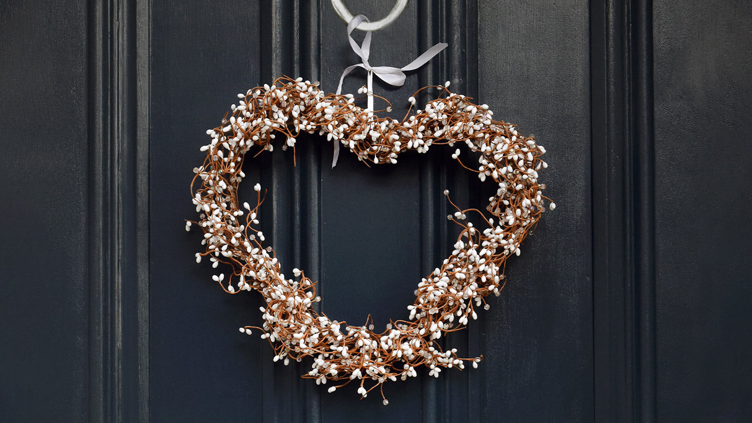 heart-shaped wreath on black door