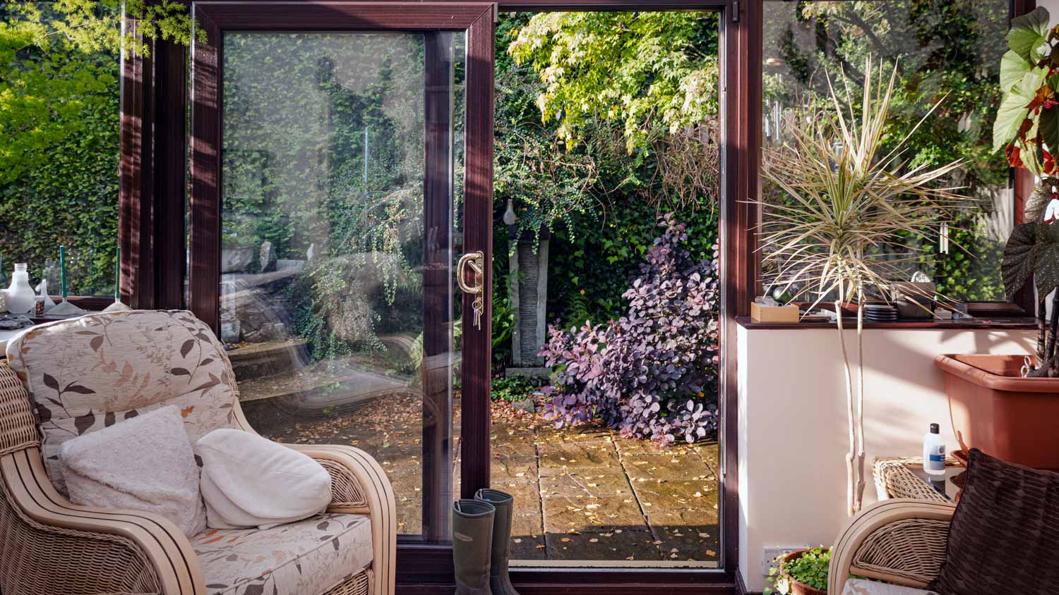 A sliding door leading to a house’s patio