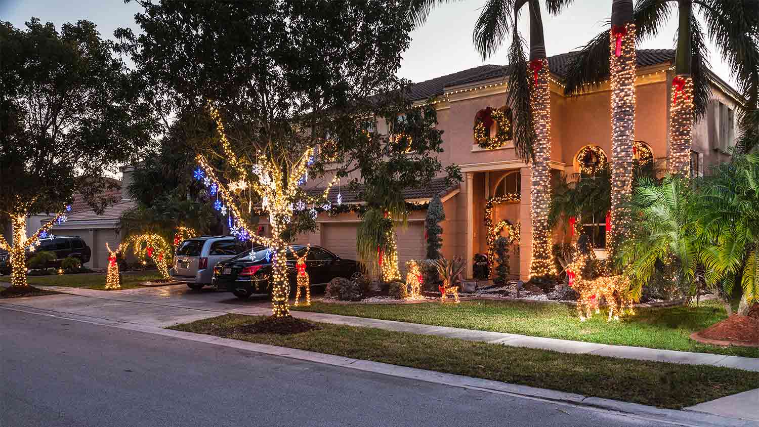 A view of a house with a tile roof with Christmas decorations