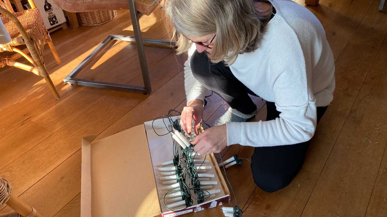 Woman storing Christmas decorations