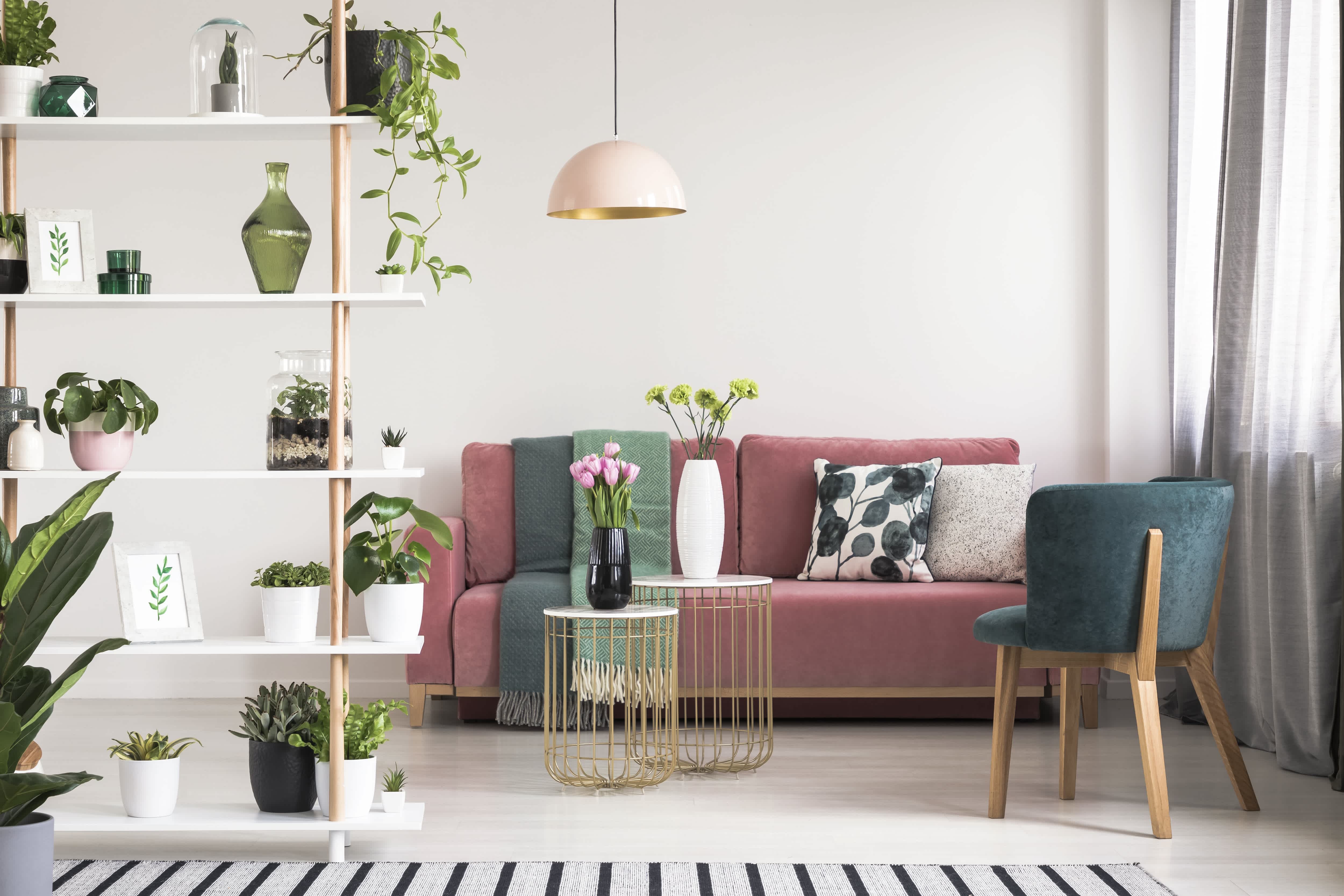 Dusty pink sofa in bohemian living room