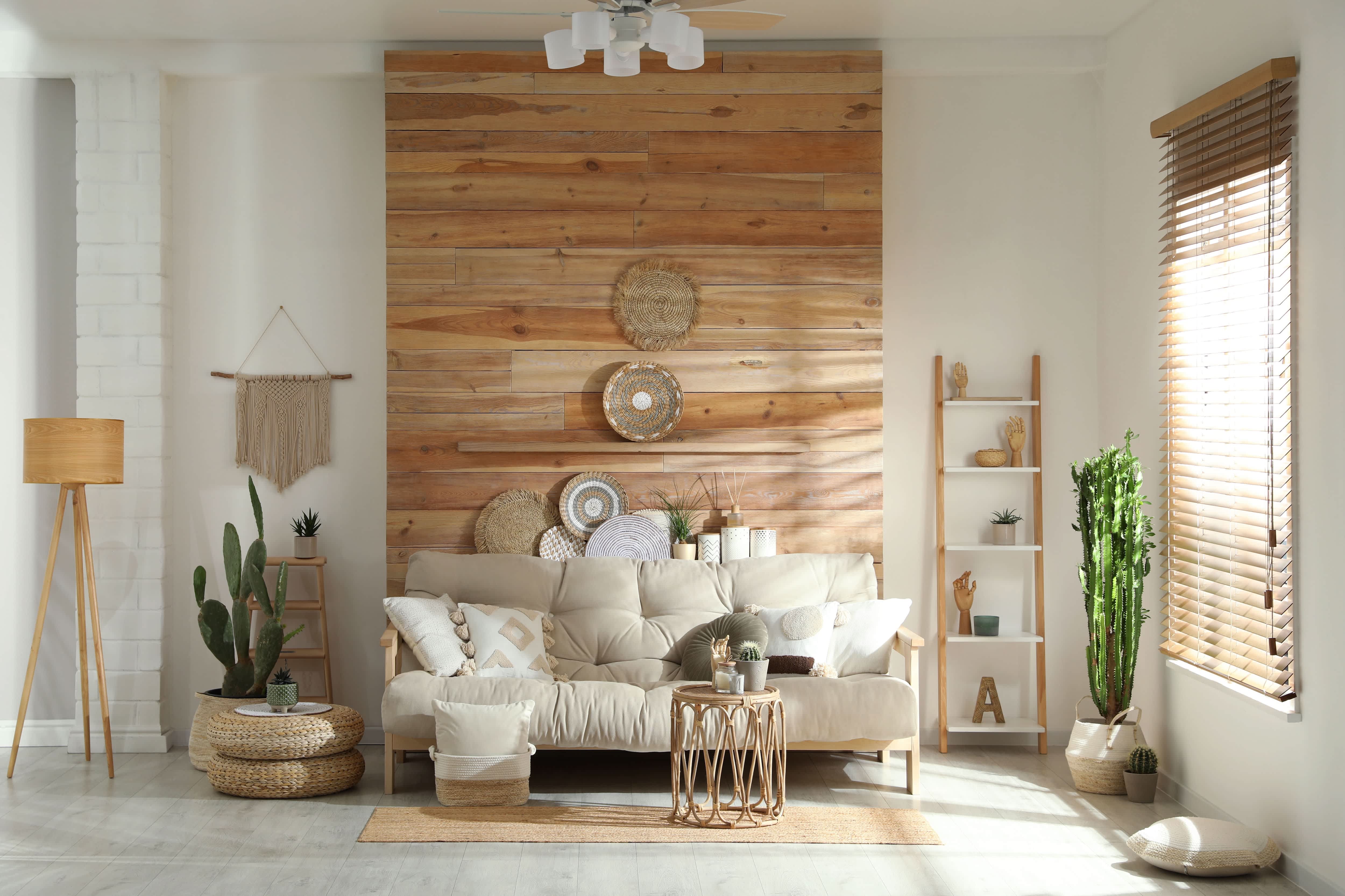 Boho living room interior with wooden accent wall