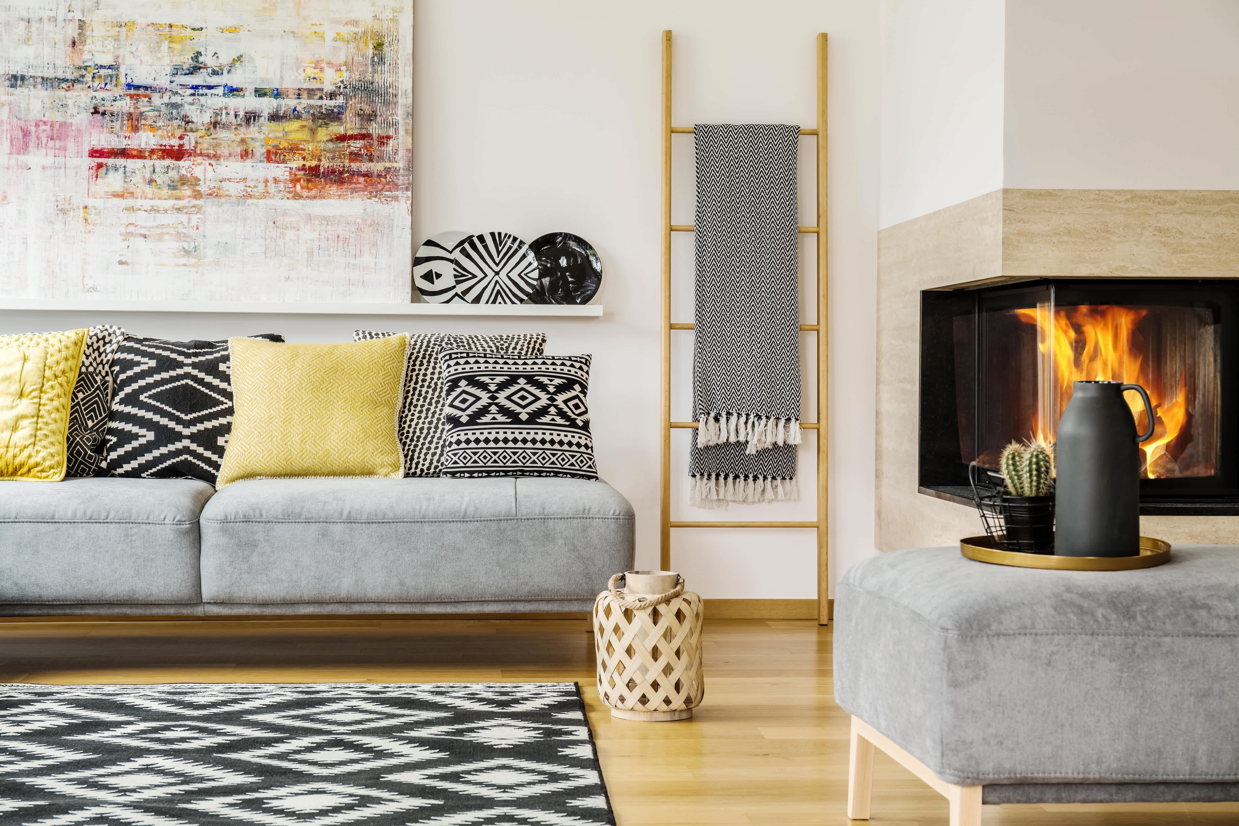 Bohemian-inspired living room with blanket ladder and fireplace