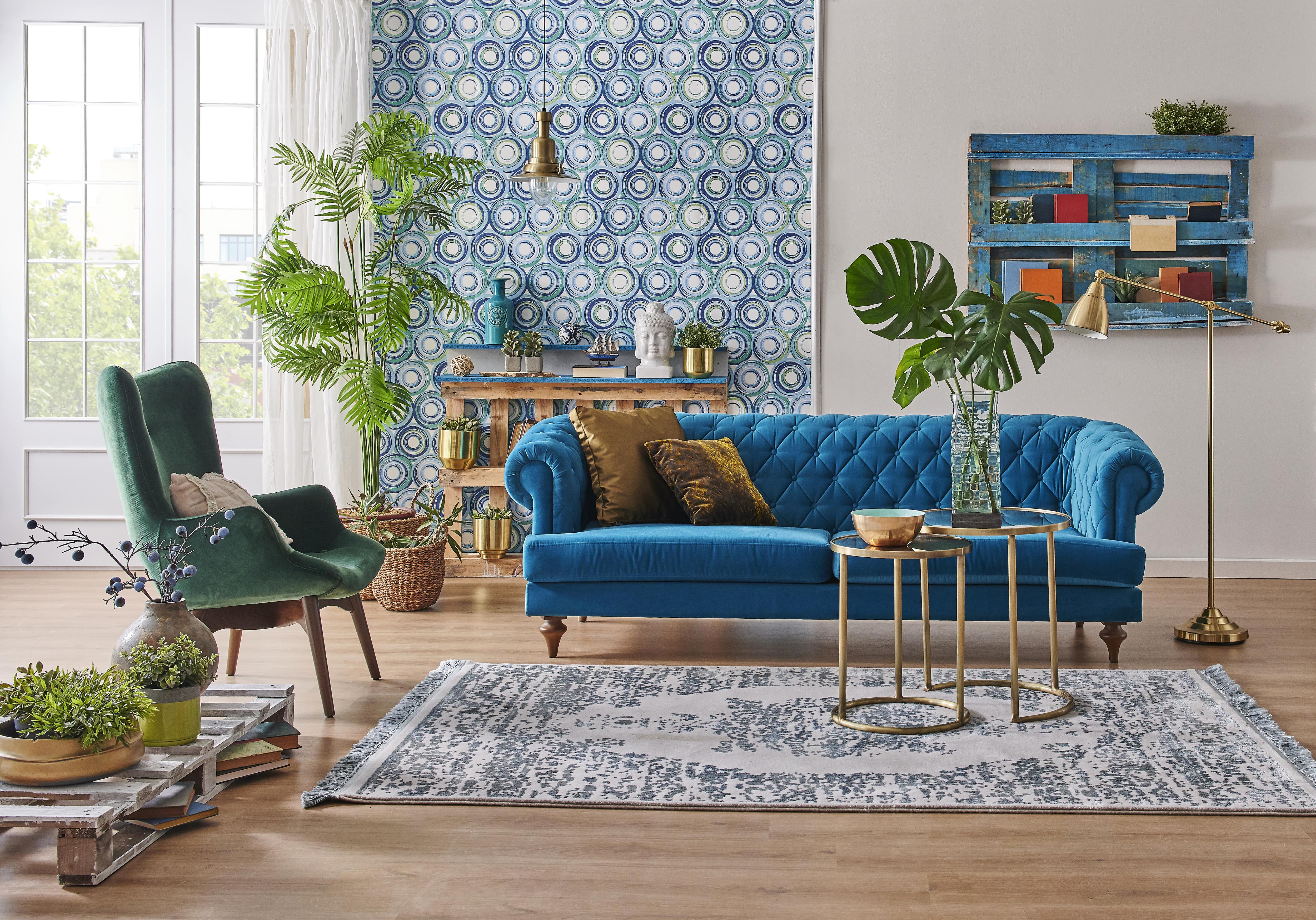 Velvet couch and chair in eclectic living room