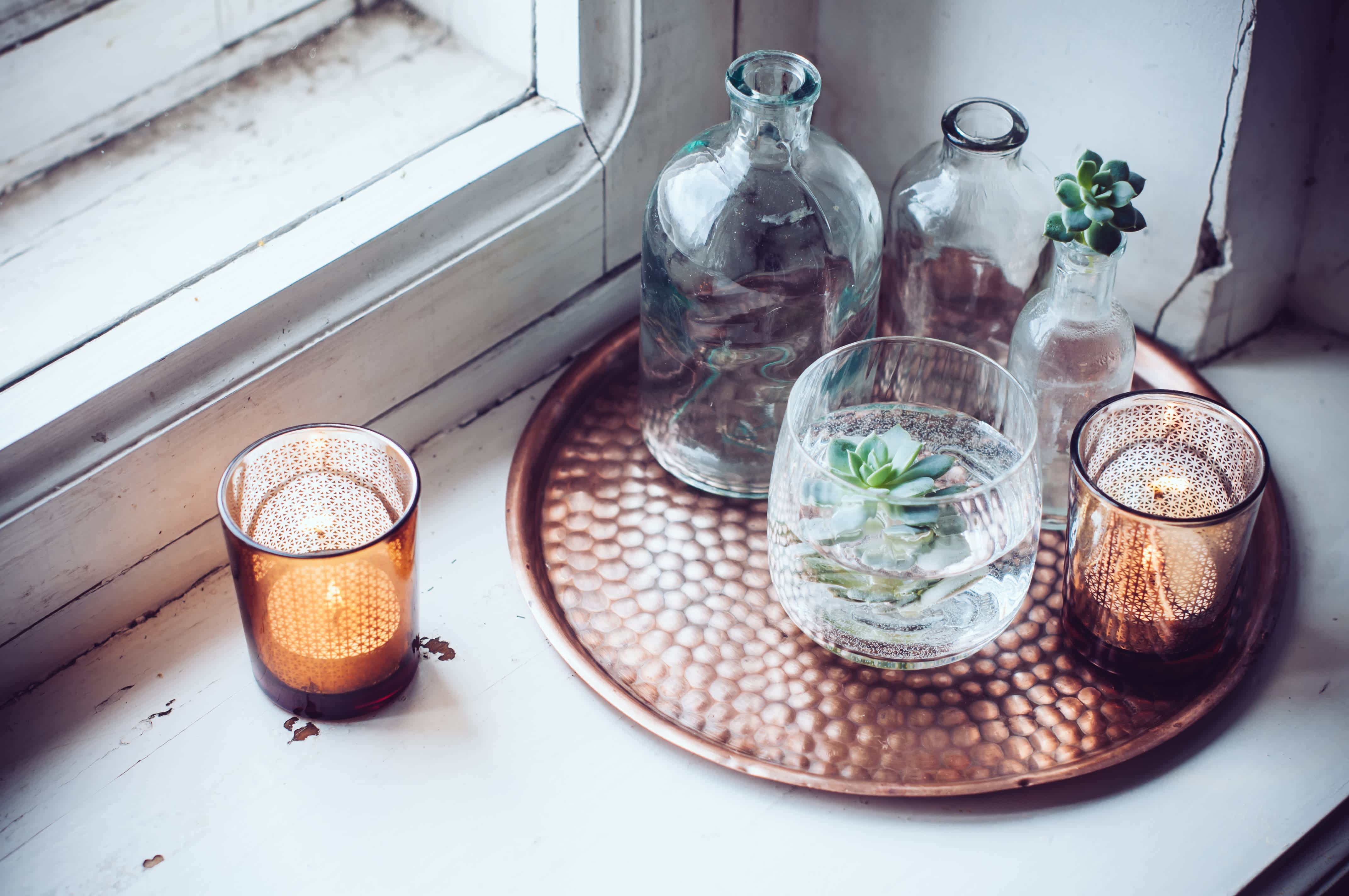 Mixed glass jars on copper serving tray