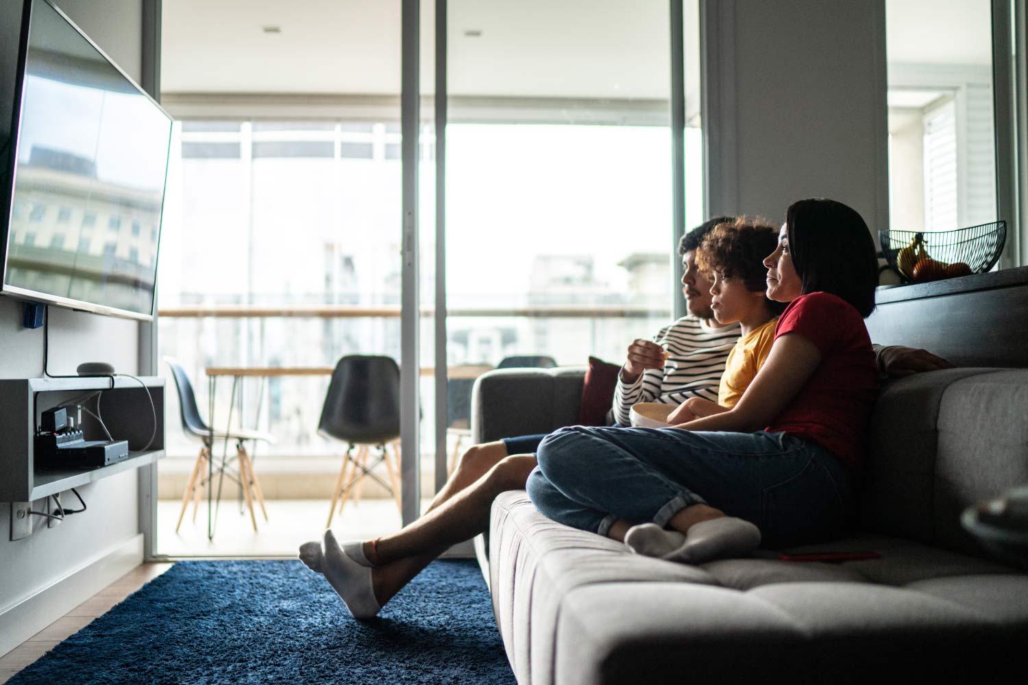 family watching tv in living room