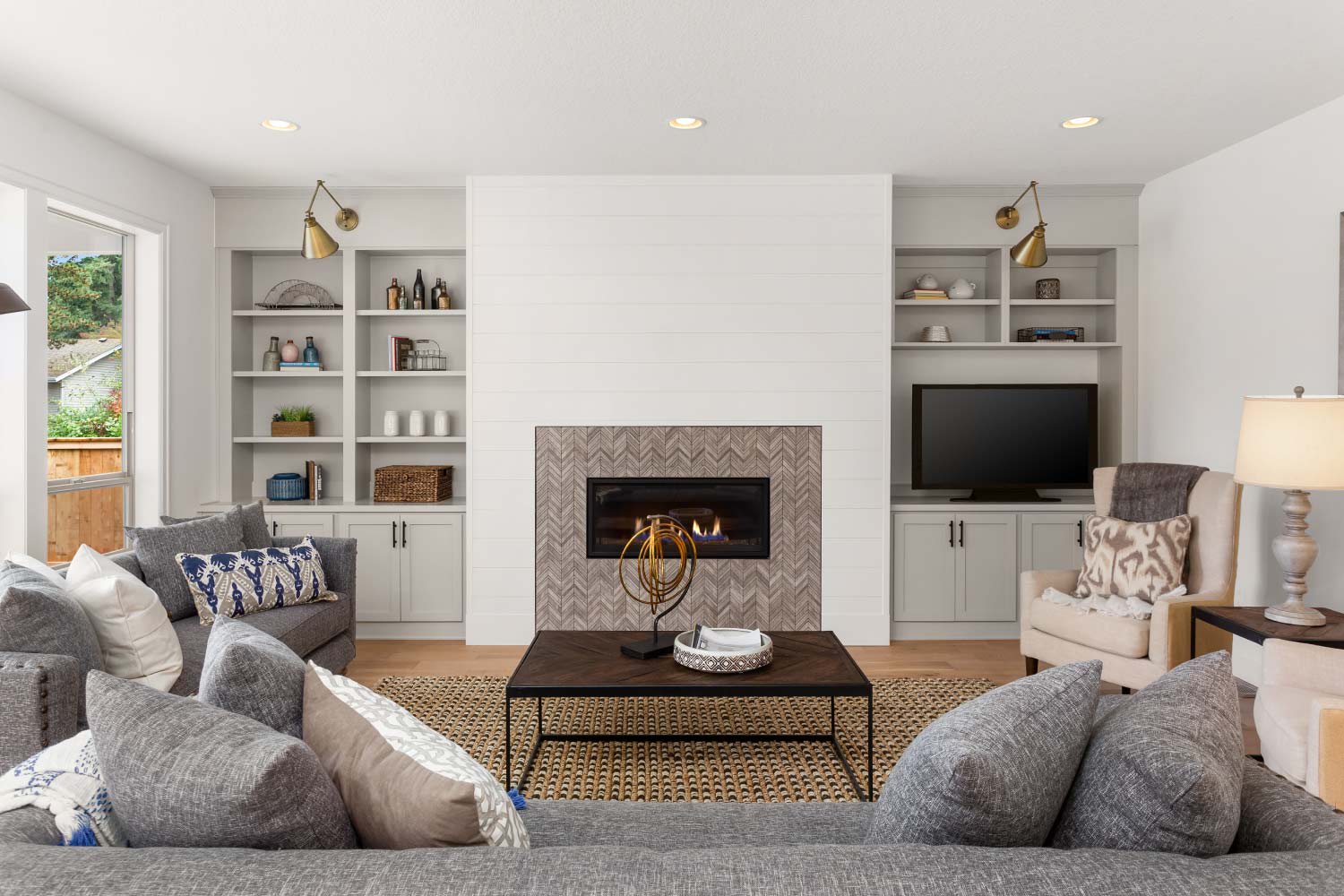 spacious living room with built-in book shelves