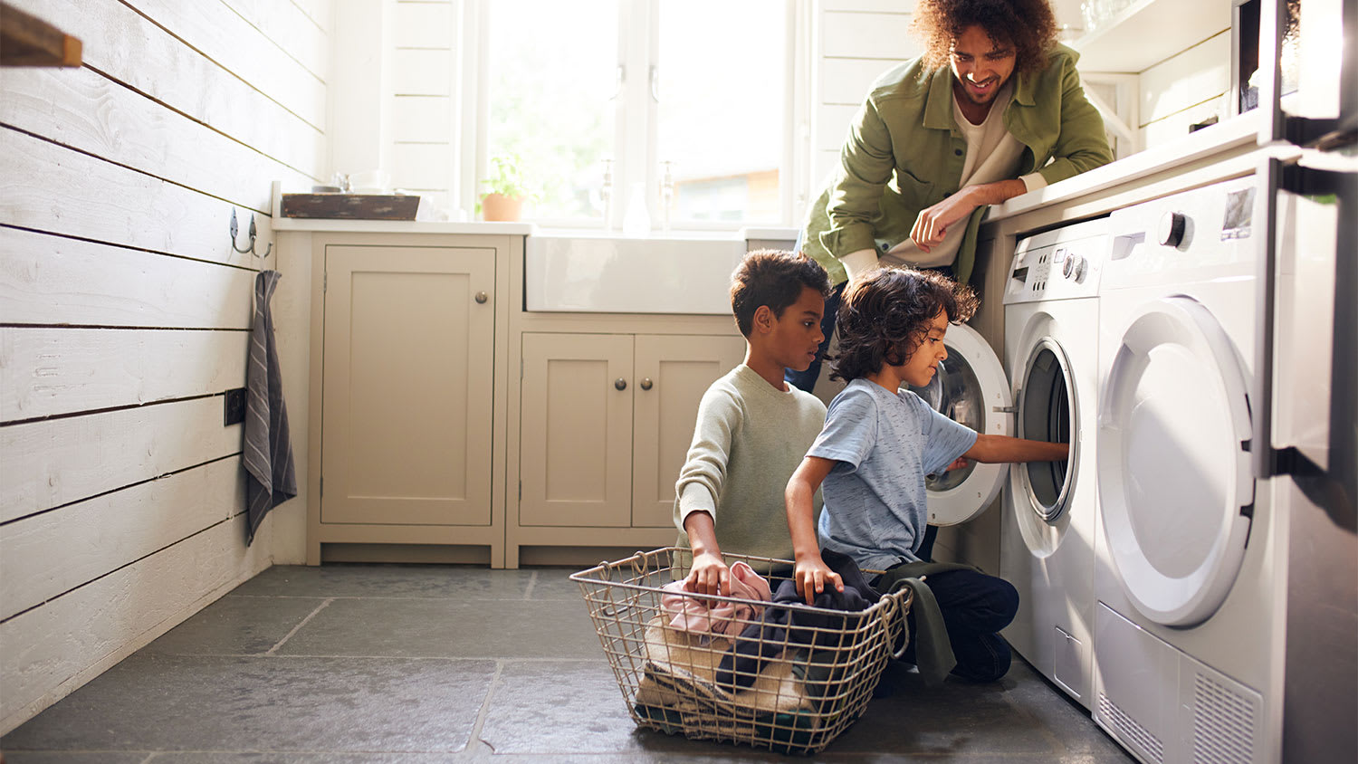 A father and his children do laundry