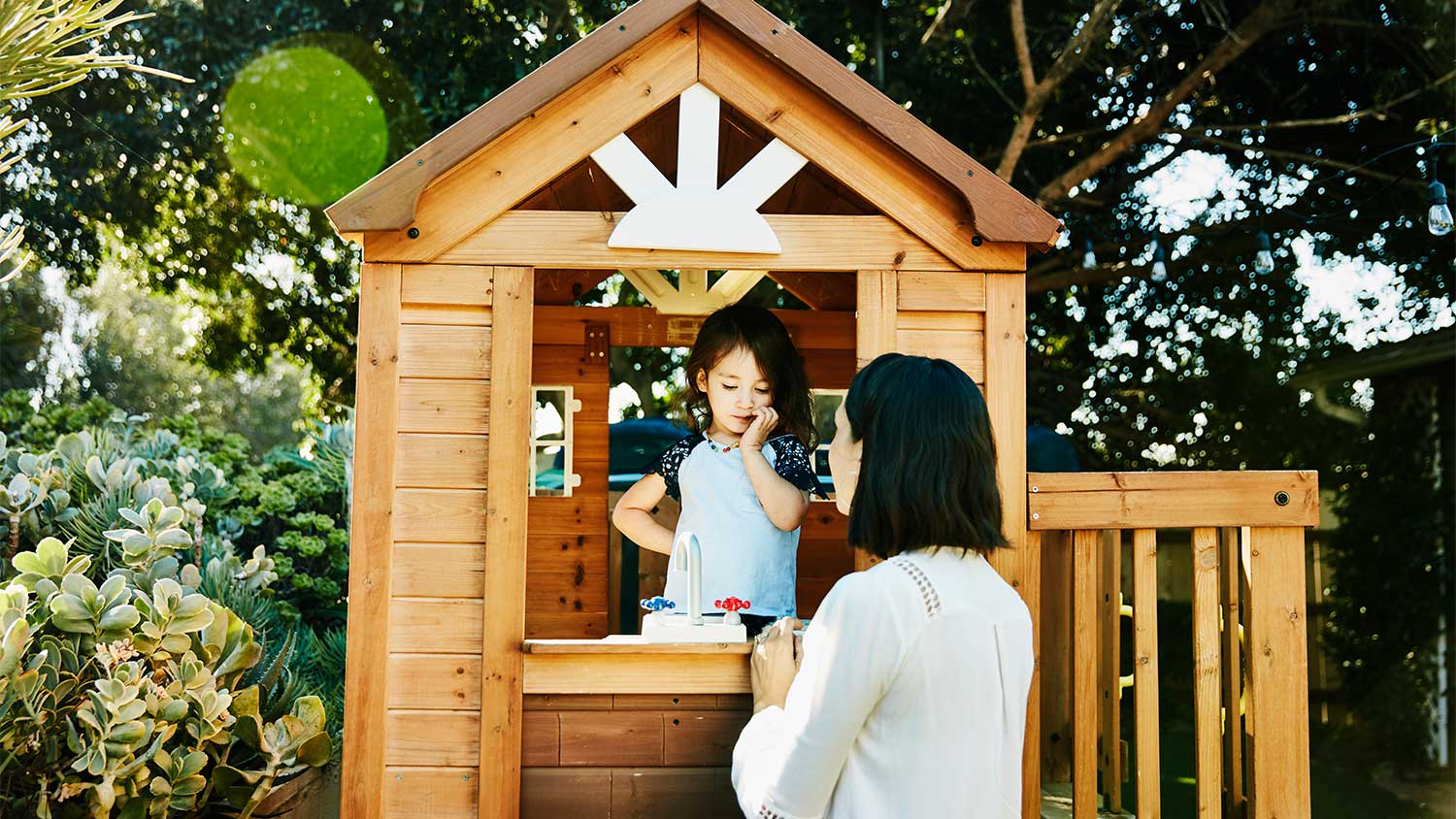 Mother and child in playhouse