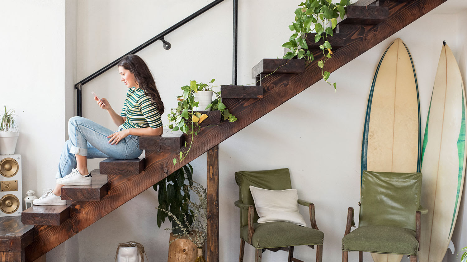 A woman sits on a staircase