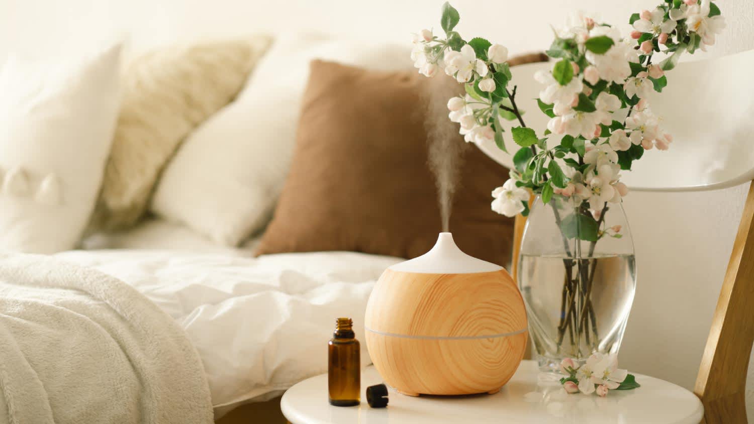 Aroma oil diffuser on chair against in the bedroom