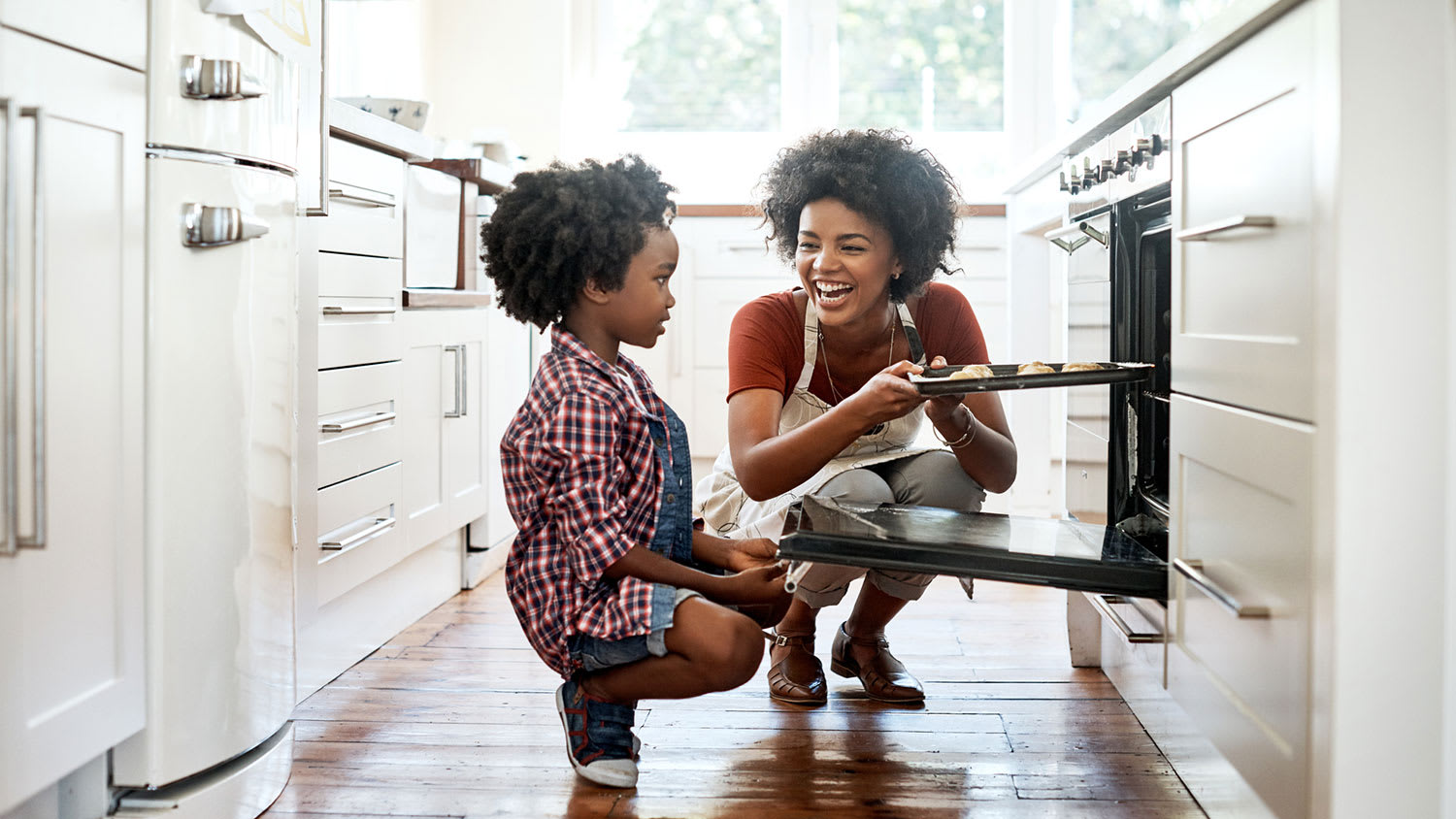 Mother and son baking together in the kitchen