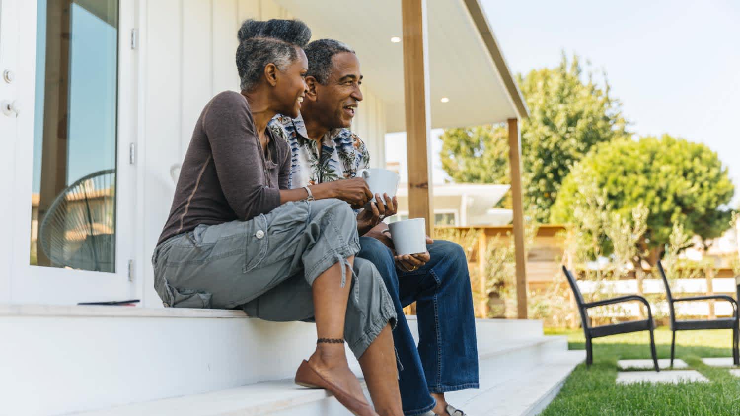 Couple drinking coffee on porch
