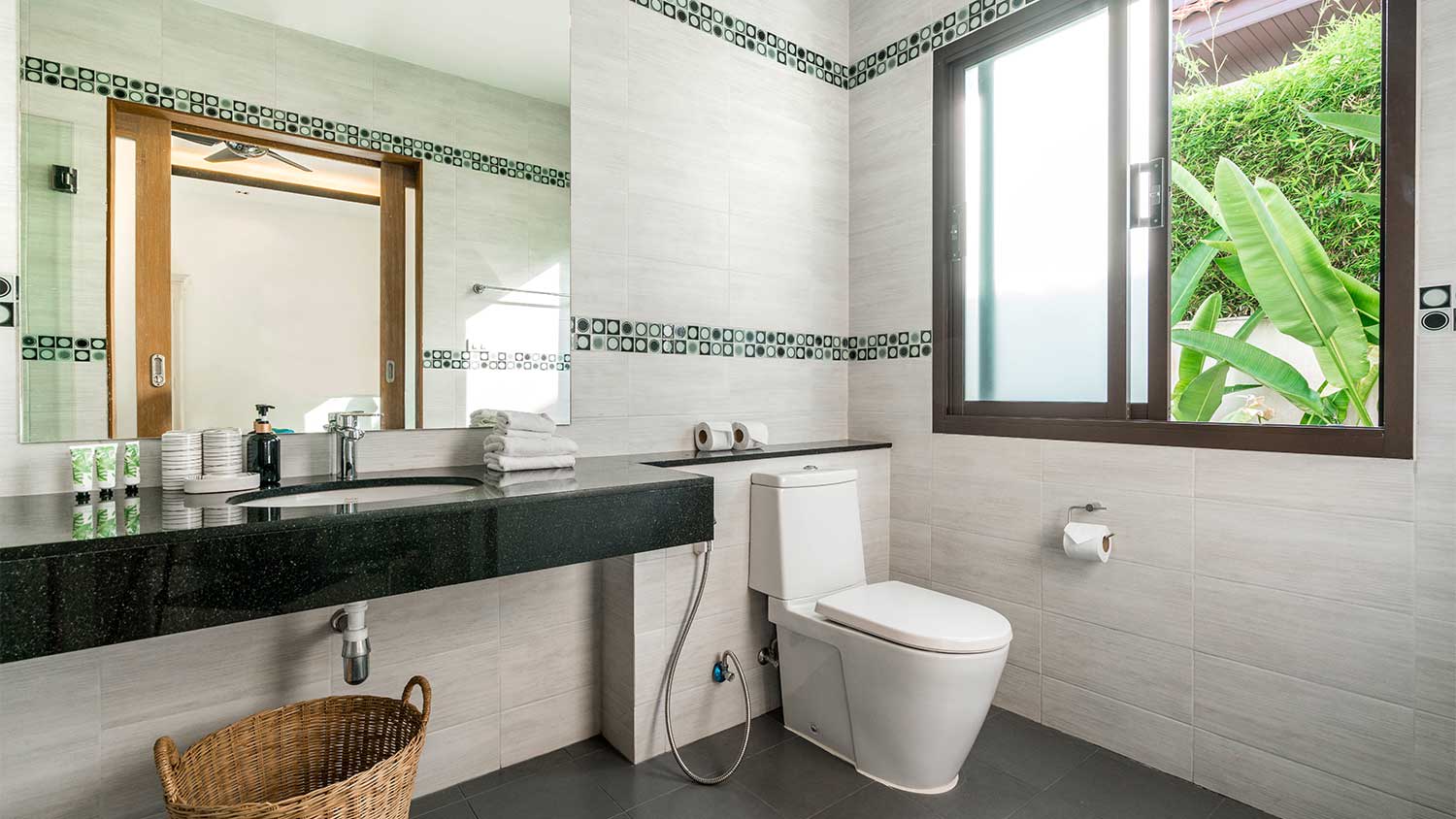 Tiled bathroom with big window