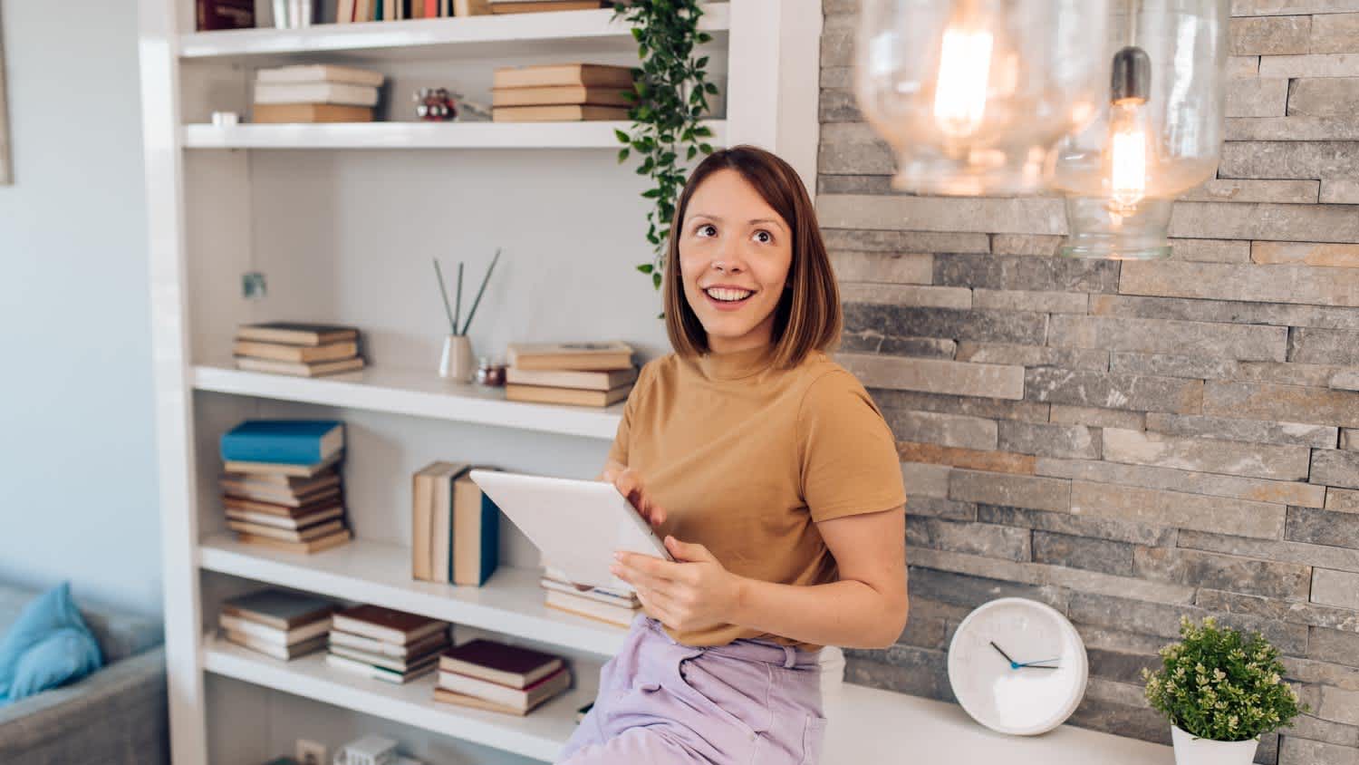 Woman adjusting a smart house system