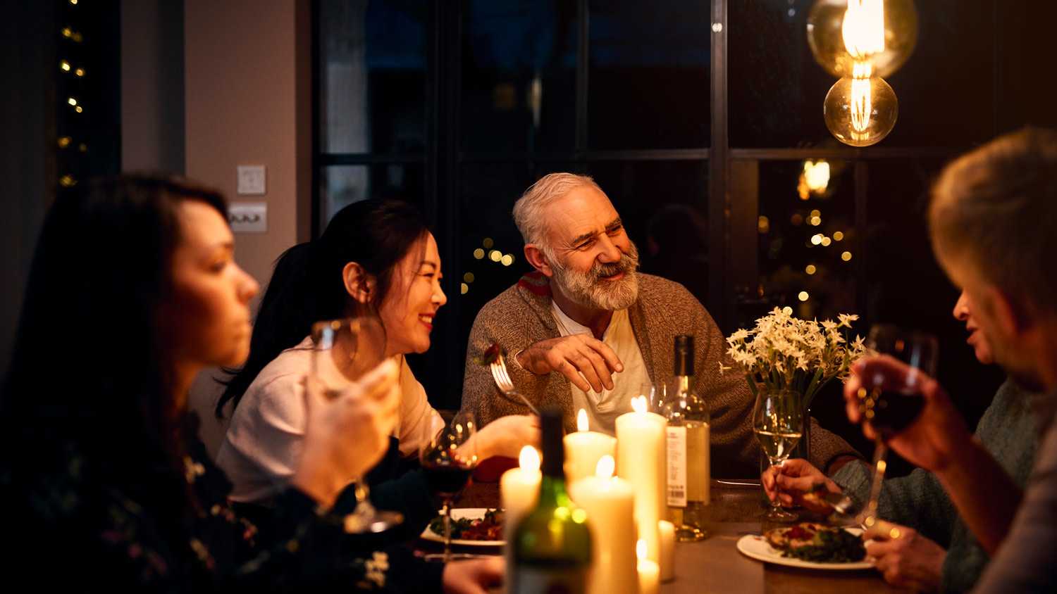 Group of friends enjoying a dinner at home