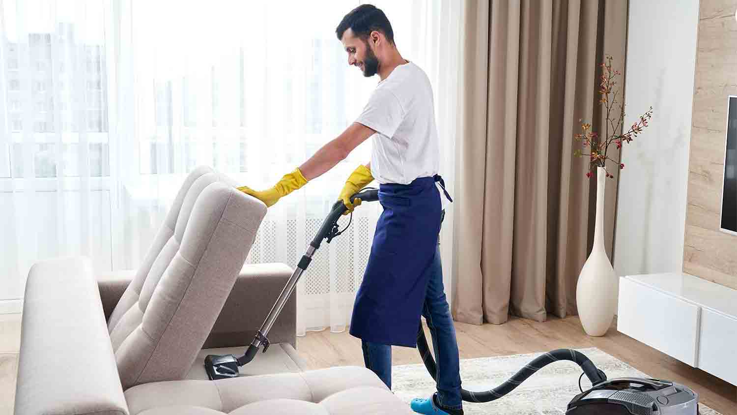 professional home cleaner vacuuming