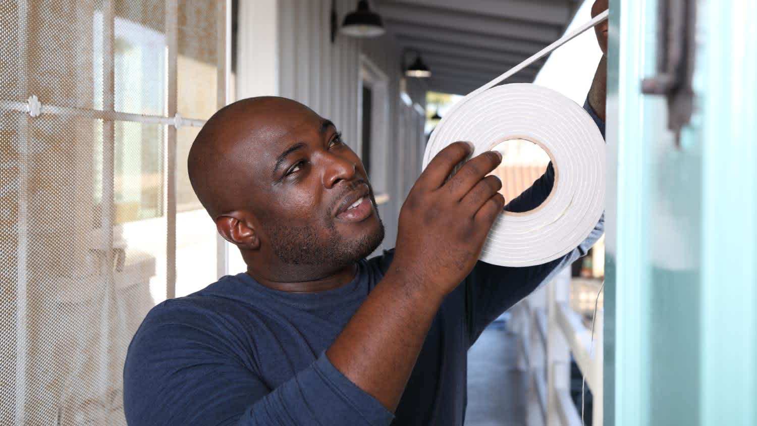 Man installing a door gasket