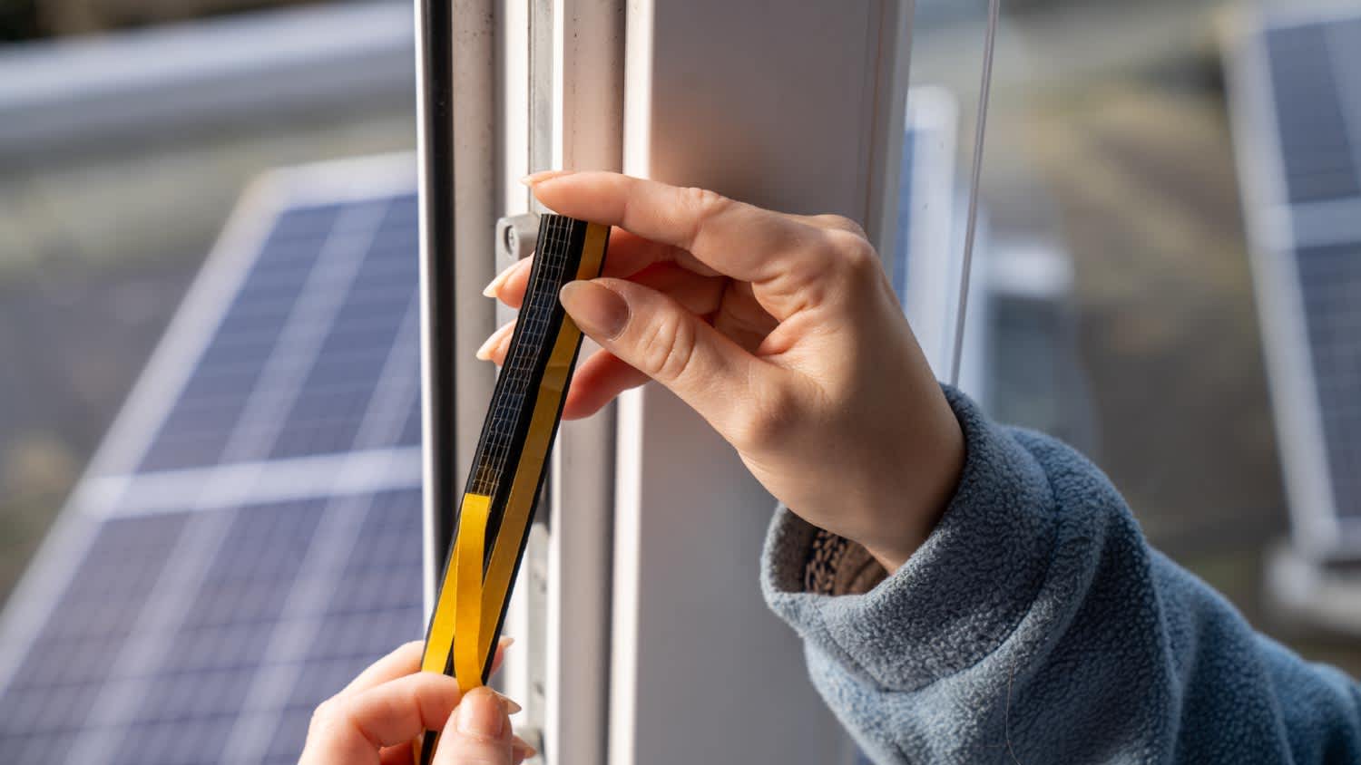 Woman installing a door gasket