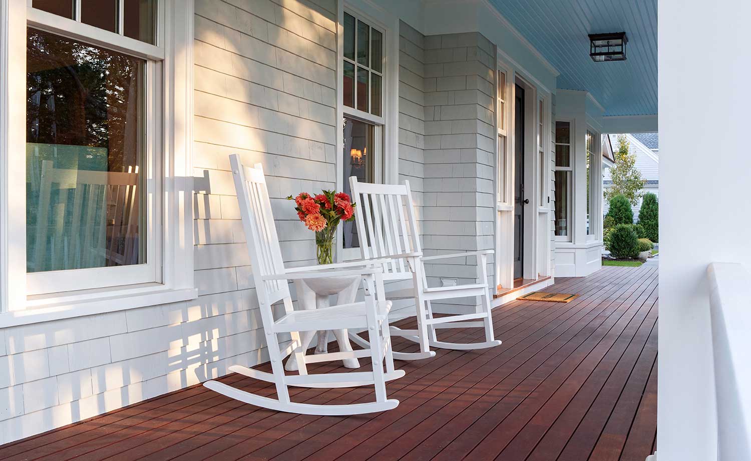 White chairs on the front porch of a house